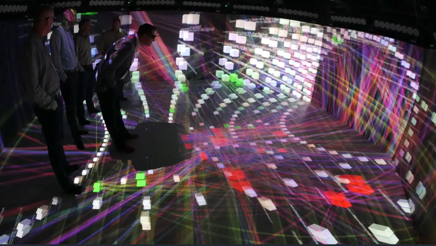 Researchers in Prof Rob Aspin's Octave Multimodal Lab CAVE environment, walking through a projected 3D knowledge graph